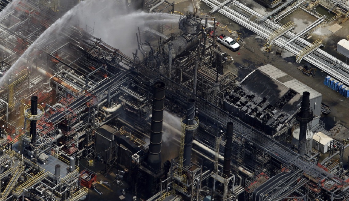 Plant Explosion A chemical plant is hosed down after a fire in this aerial photo about twenty miles southeast of Baton Rouge, in Geismer, La., Thursday, June 13, 2013. The plant makes highly flammable gases that are basic building blocks in the petrochemical industry. (AP Photo/Gerald Herbert)